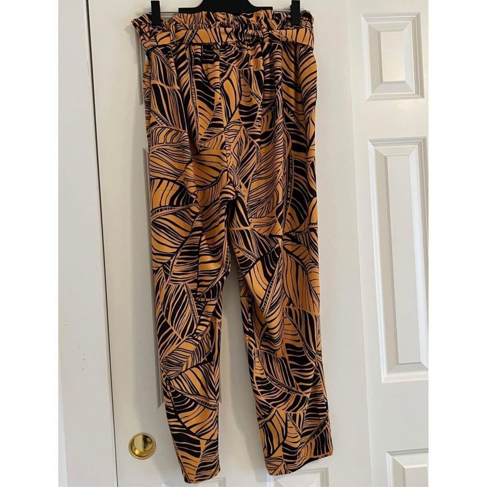 Yellow and Black Print Pants. Tapered legs. High waist. Pockets. Brand new witho